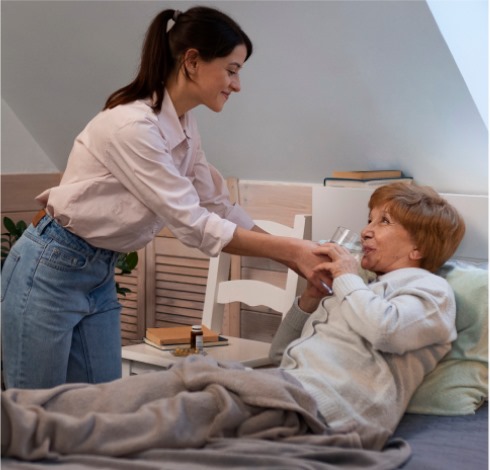 Elderly woman with a caregiver